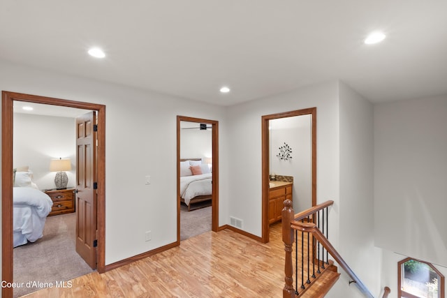 515 S Idaho St, Post Falls, ID 83854 - hallway with an upstairs landing, light wood-style flooring, and recessed lighting