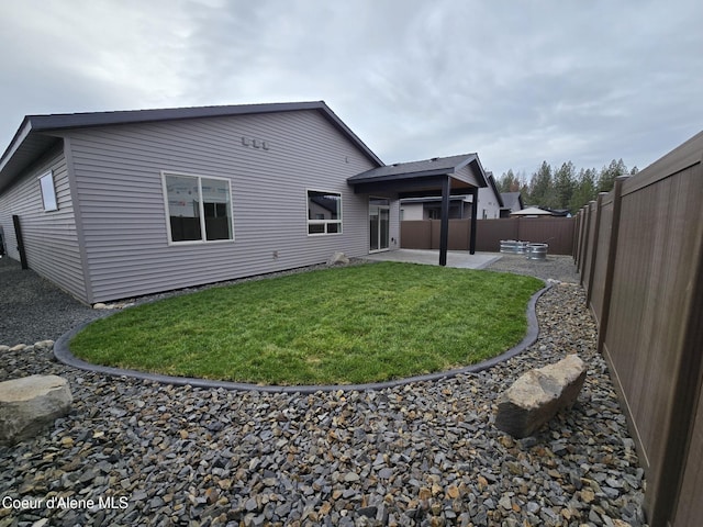 13936 N Rainier Loop, Rathdrum, ID 83858 - back of property featuring a patio and a fenced backyard