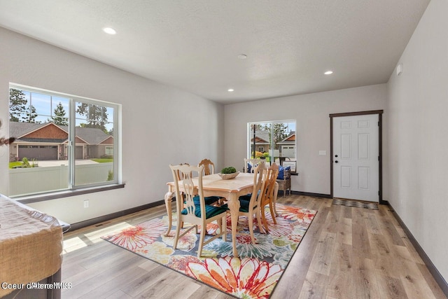 1546 N Tatum Dr, Post Falls, ID 83854 - dining area featuring plenty of natural light, light wood-type flooring, and recessed lighting