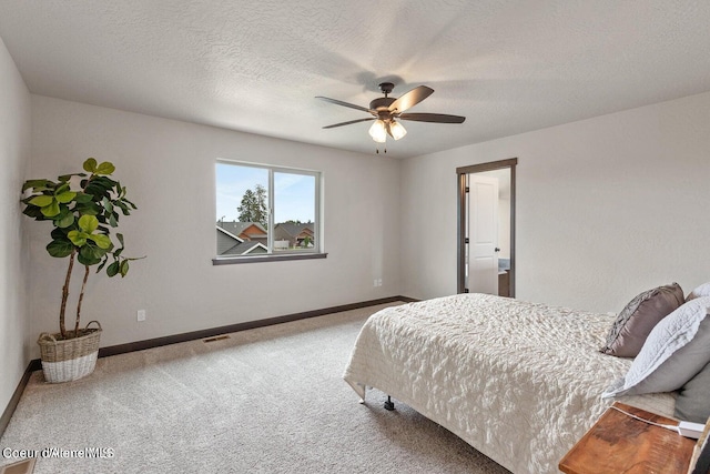 1546 N Tatum Dr, Post Falls, ID 83854 - bedroom featuring carpet, a ceiling fan, and a textured ceiling