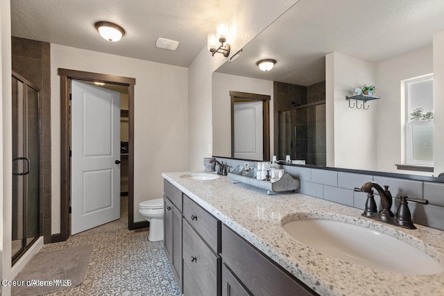 1546 N Tatum Dr, Post Falls, ID 83854 - bathroom with a stall shower and double vanity