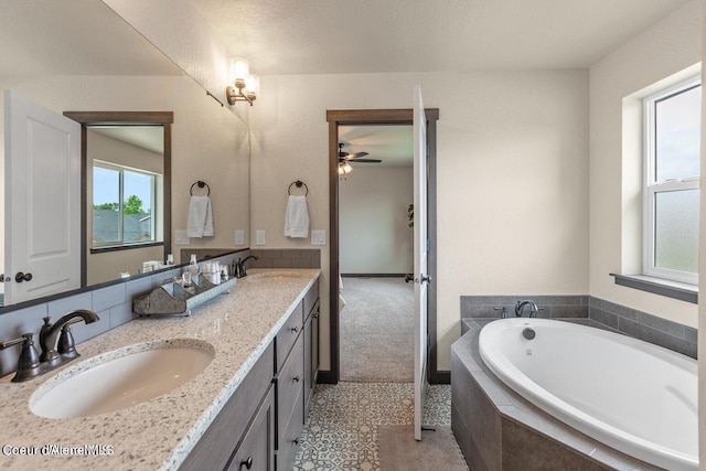 1546 N Tatum Dr, Post Falls, ID 83854 - full bathroom featuring a ceiling fan, a bath, and double vanity
