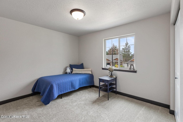 1546 N Tatum Dr, Post Falls, ID 83854 - bedroom featuring carpet and a textured ceiling