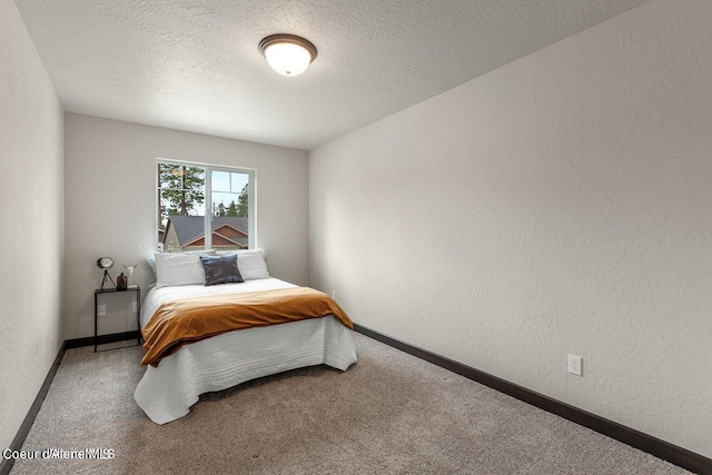 1546 N Tatum Dr, Post Falls, ID 83854 - carpeted bedroom with a textured wall and a textured ceiling