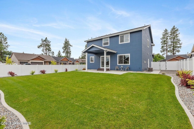 1546 N Tatum Dr, Post Falls, ID 83854 - back of house with a patio, a fenced backyard, and a gate