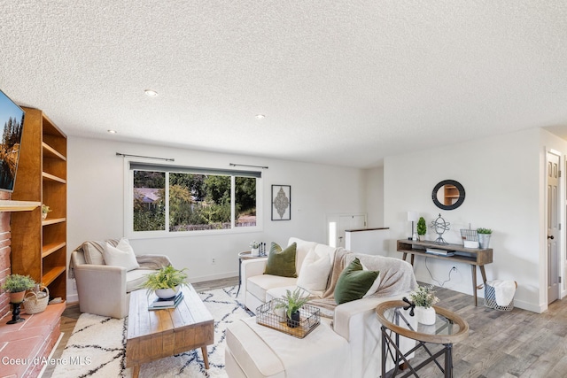 1024 W Mill Ave, Coeur Dalene, ID 83814 - living room with wood finished floors, a textured ceiling, and recessed lighting