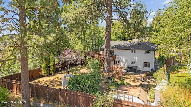 1024 W Mill Ave, Coeur Dalene, ID 83814 - fenced backyard featuring a fire pit and a wooden deck