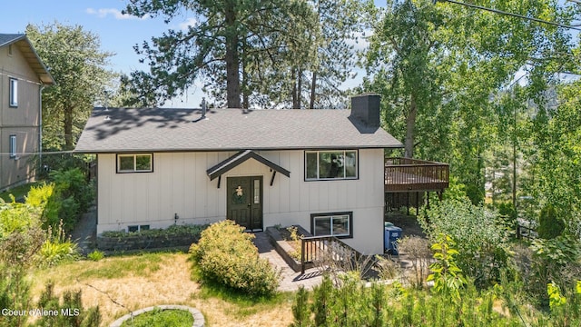 1024 W Mill Ave, Coeur Dalene, ID 83814 - raised ranch with a chimney, a deck, and a shingled roof