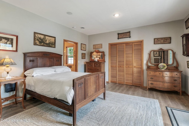 512 River Dr, Clark Fork, ID 83811 - bedroom featuring a closet, light wood-style flooring, and recessed lighting