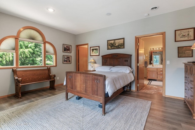 512 River Dr, Clark Fork, ID 83811 - bedroom with light wood finished floors, ensuite bathroom, and recessed lighting