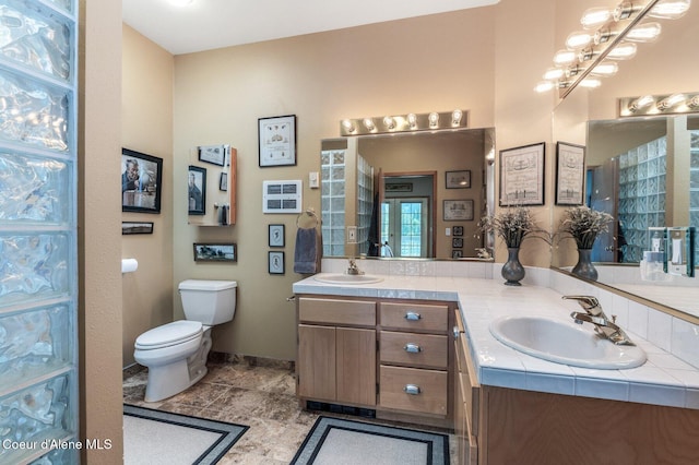 512 River Dr, Clark Fork, ID 83811 - bathroom featuring double vanity and toilet