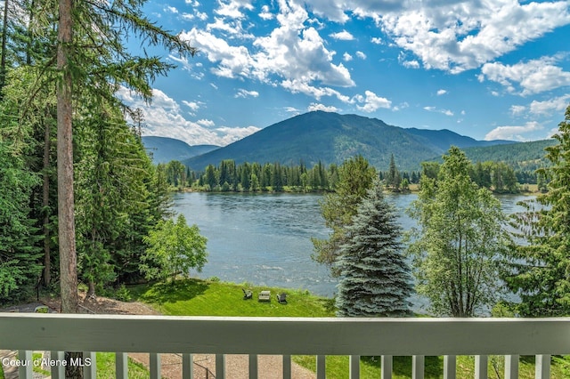 512 River Dr, Clark Fork, ID 83811 - water view with a mountainous background and a heavily wooded area
