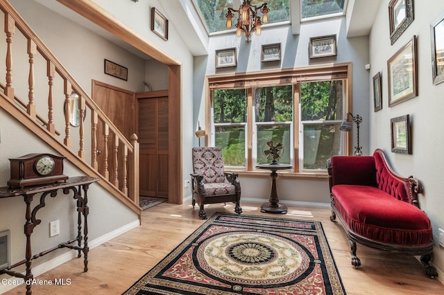 512 River Dr, Clark Fork, ID 83811 - entryway with wood finished floors, stairway, and a skylight