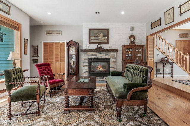512 River Dr, Clark Fork, ID 83811 - living room with wood finished floors, a fireplace, recessed lighting, and stairs