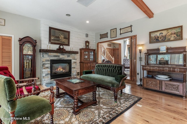 512 River Dr, Clark Fork, ID 83811 - living area with a fireplace, wood finished floors, stairway, recessed lighting, and beam ceiling