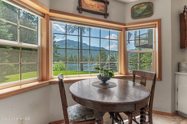 512 River Dr, Clark Fork, ID 83811 - dining space featuring a water and mountain view and baseboards