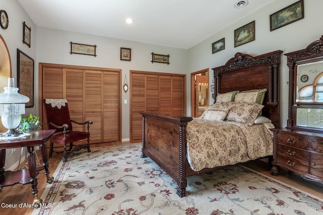 512 River Dr, Clark Fork, ID 83811 - bedroom featuring wood finished floors, multiple closets, and recessed lighting