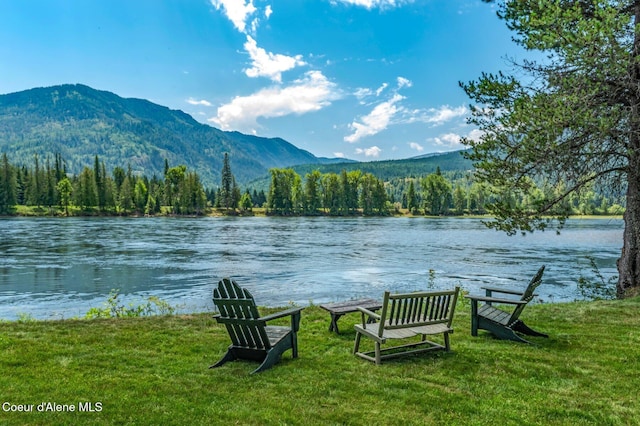512 River Dr, Clark Fork, ID 83811 - water view with a forest and a mountain backdrop