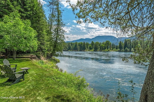 512 River Dr, Clark Fork, ID 83811 - water view with a forest and a mountain backdrop