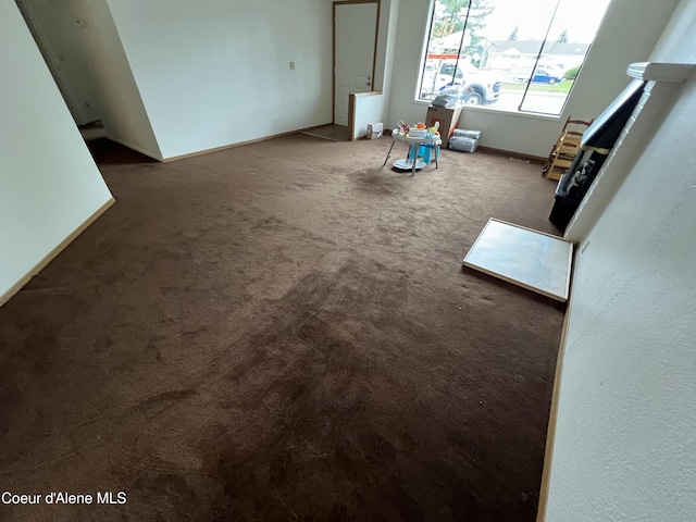3848 E 2nd Ave, Post Falls, ID 83854 - unfurnished living room with carpet floors
