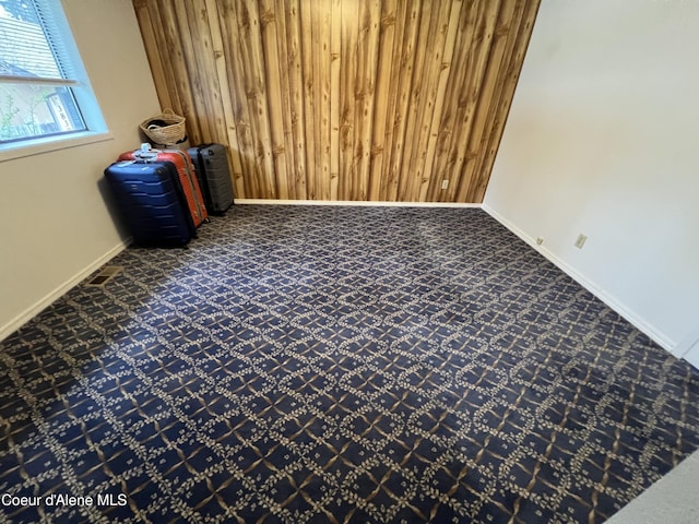 3848 E 2nd Ave, Post Falls, ID 83854 - carpeted spare room featuring baseboards and wood walls