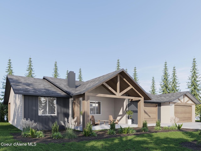 L1B1 Sylvan Rd, Athol, ID 83801 - view of front of property featuring an attached garage, a chimney, board and batten siding, concrete driveway, and a front lawn