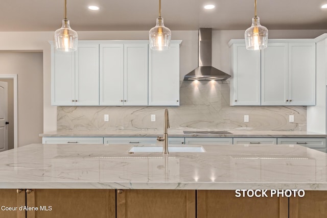 L1B1 Sylvan Rd, Athol, ID 83801 - kitchen with wall chimney exhaust hood, backsplash, light stone counters, and recessed lighting