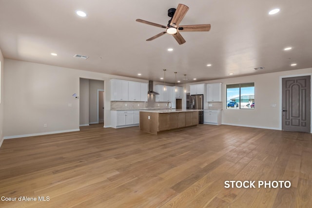 L1B1 Sylvan Rd, Athol, ID 83801 - kitchen with open floor plan, stainless steel fridge with ice dispenser, light countertops, white cabinetry, and recessed lighting