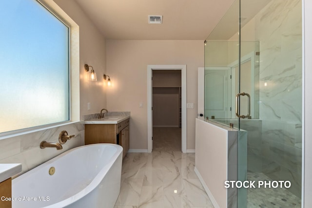 L1B1 Sylvan Rd, Athol, ID 83801 - bathroom featuring vanity, a freestanding tub, a shower stall, and marble finish flooring