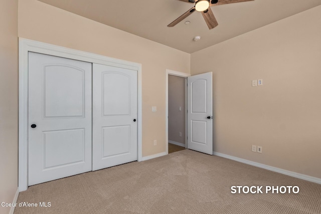 L1B1 Sylvan Rd, Athol, ID 83801 - unfurnished bedroom with carpet flooring, a closet, and a ceiling fan