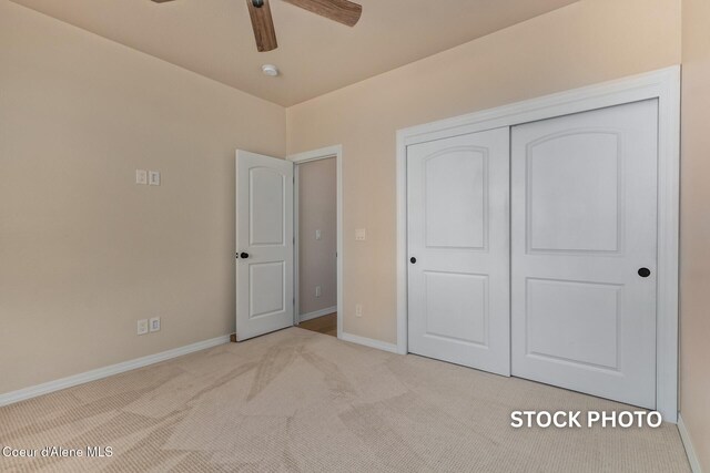 L1B1 Sylvan Rd, Athol, ID 83801 - unfurnished bedroom featuring carpet, a closet, and ceiling fan