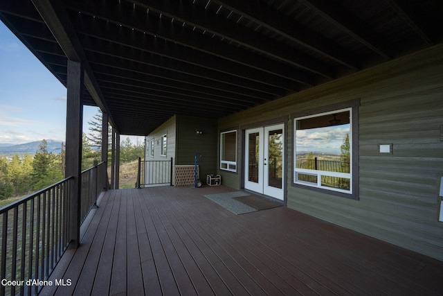 5969 W Highland Dr, Coeur Dalene, ID 83814 - wooden deck featuring french doors and a mountain view