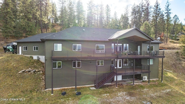 5969 W Highland Dr, Coeur Dalene, ID 83814 - back of property featuring stairway and a wooden deck