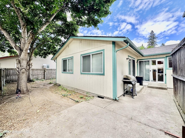 3674 E 2nd Ave, Post Falls, ID 83854 - view of home's exterior with a patio and a fenced backyard