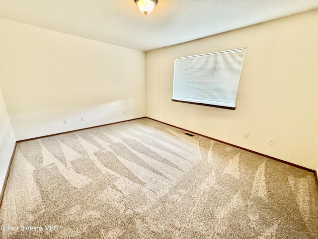 3674 E 2nd Ave, Post Falls, ID 83854 - carpeted spare room with baseboards