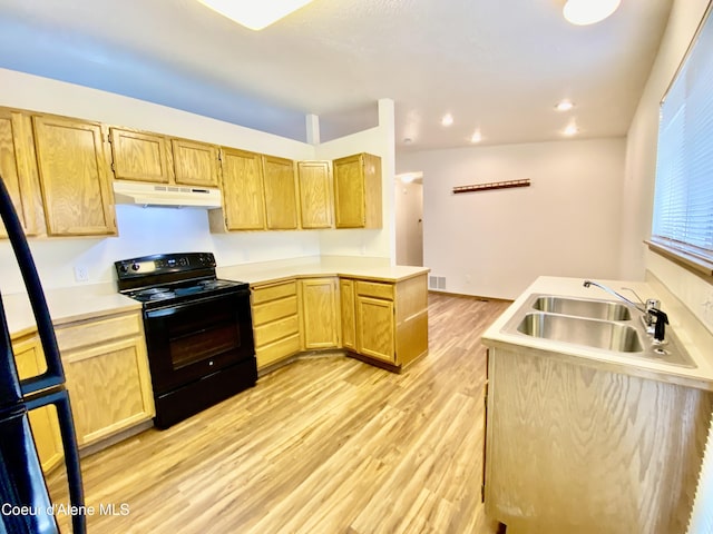 3674 E 2nd Ave, Post Falls, ID 83854 - kitchen featuring black electric range, under cabinet range hood, light brown cabinets, a peninsula, and light wood finished floors