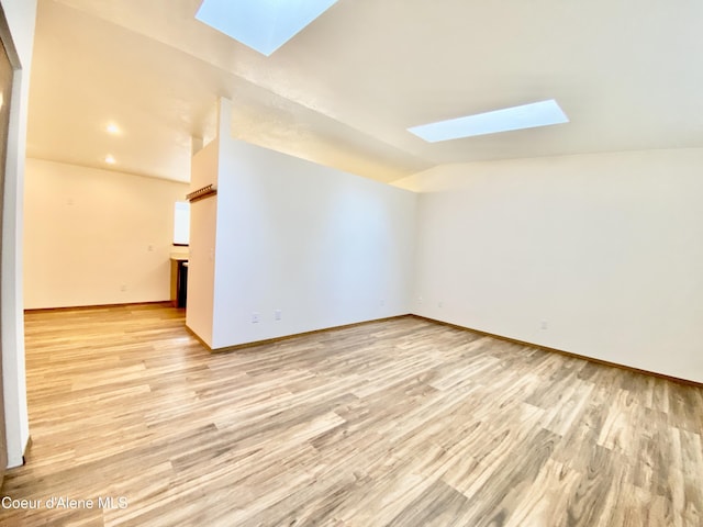 3674 E 2nd Ave, Post Falls, ID 83854 - additional living space featuring a skylight, light wood-type flooring, vaulted ceiling, and recessed lighting
