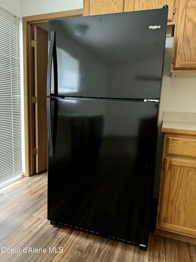 3674 E 2nd Ave, Post Falls, ID 83854 - kitchen with freestanding refrigerator, wood finished floors, and light countertops