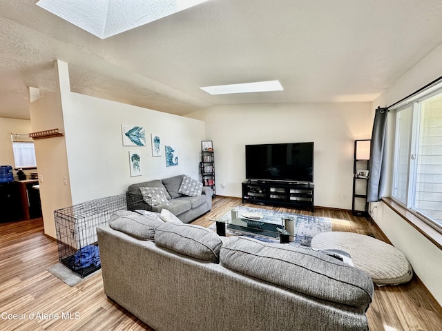 3674 E 2nd Ave, Post Falls, ID 83854 - living area with a skylight, light wood finished floors, and healthy amount of natural light