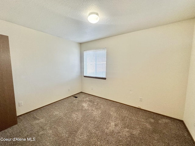 3674 E 2nd Ave, Post Falls, ID 83854 - carpeted spare room featuring baseboards