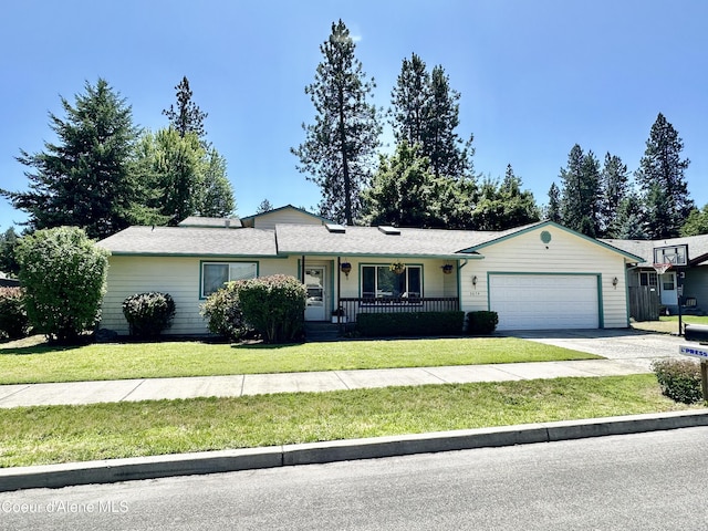 3674 E 2nd Ave, Post Falls, ID 83854 - ranch-style home featuring an attached garage, a front yard, and concrete driveway
