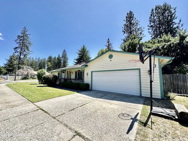 3674 E 2nd Ave, Post Falls, ID 83854 - ranch-style house featuring driveway, an attached garage, and a porch