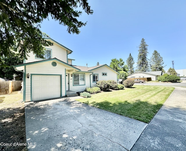 3674 E 2nd Ave, Post Falls, ID 83854 - traditional-style house with a garage and concrete driveway