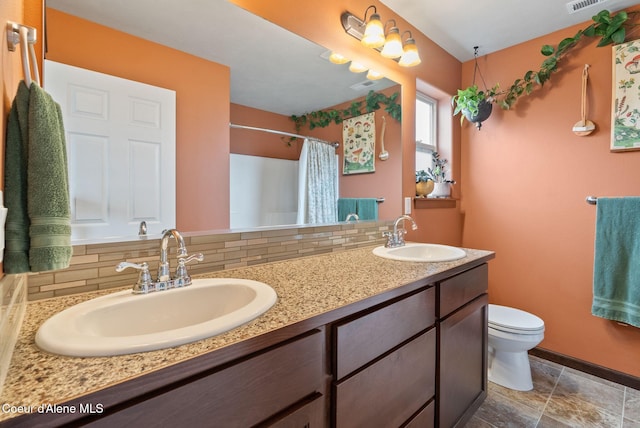6595 W Covenant St, Rathdrum, ID 83858 - full bath featuring tasteful backsplash, double vanity, and a shower with curtain
