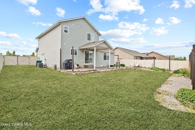 6595 W Covenant St, Rathdrum, ID 83858 - back of house with a patio area, a gate, and a fenced backyard