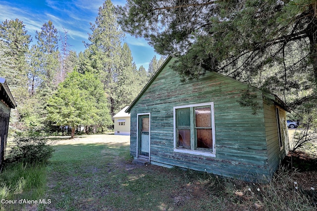 67 Nuchols Gulch Rd, Osburn, ID 83849 - view of side of property with a lawn