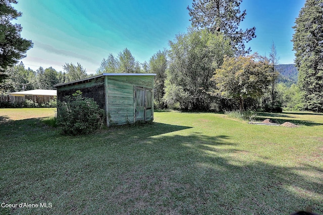 67 Nuchols Gulch Rd, Osburn, ID 83849 - view of grassy yard featuring a storage unit