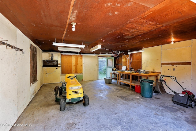 67 Nuchols Gulch Rd, Osburn, ID 83849 - garage featuring a workshop area