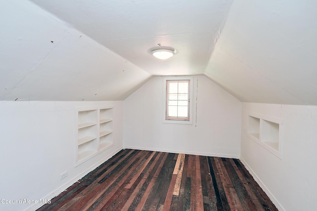 67 Nuchols Gulch Rd, Osburn, ID 83849 - additional living space featuring built in shelves, wood finished floors, and vaulted ceiling