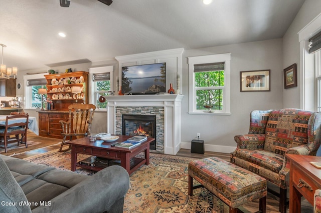 307 S 18th St, Coeur Dalene, ID 83814 - living area featuring a fireplace, wood finished floors, a ceiling fan, recessed lighting, and a chandelier